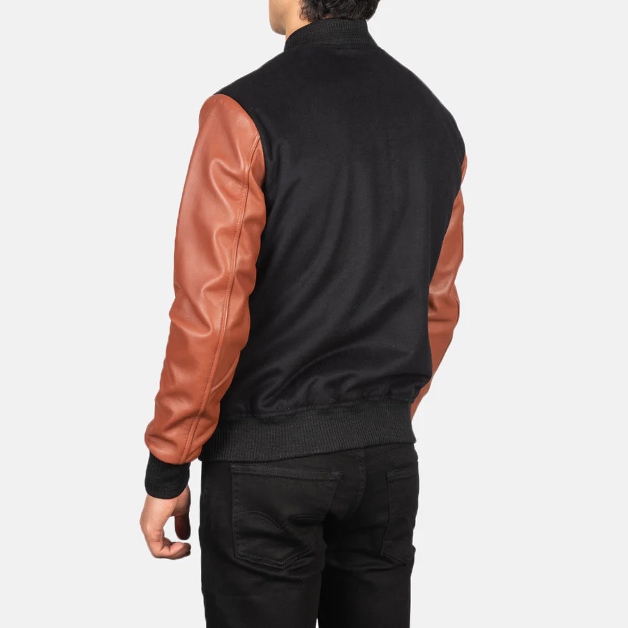 brown and black varsity jacket​